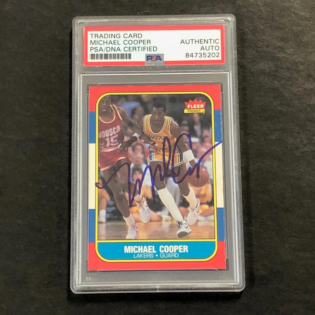 1986 Fleer #17 Michael Cooper Signed Card PSA Authenticated Lakers: 1986 Fleer #17 Michael Cooper Signed Card PSA Authenticated Lakers This listing features a 1986 Fleer #17 basketball card, personally signed by Michael Cooper, a celebrated player for the Los Angeles 