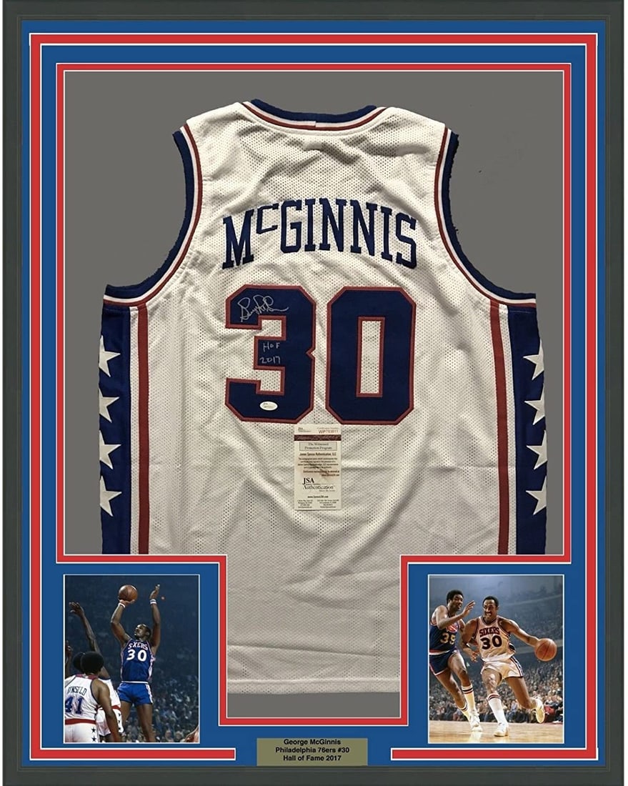 Framed George McGinnis signed Philadelphia 76ers white jersey JSA COA 33x42: Framed George McGinnis signed Philadelphia 76ers white jersey JSA COA 33x42 This professionally framed and matted Philadelphia 76ers white jersey features the authentic autograph of George McGinnis. T