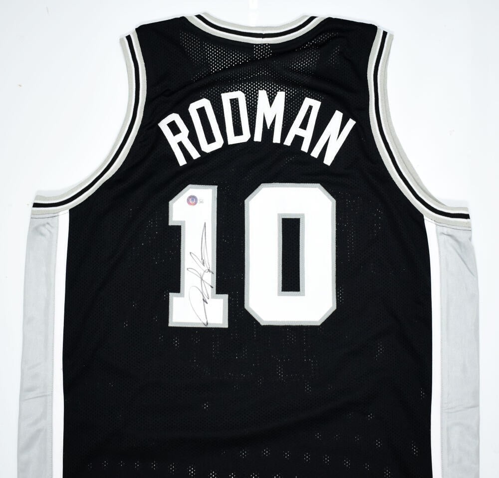 Dennis Rodman signed Spurs black jersey Beckett hologram: Dennis Rodman signed Spurs black jersey Beckett hologram This is a black jersey autographed by Dennis Rodman, featuring authentication by Beckett Authentication Services (BAS). The jersey represents t
