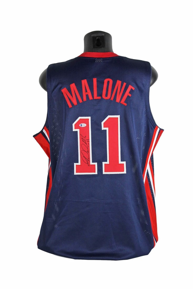 Authentic Karl Malone USA Jersey Signed with Mailman Inscription BAS Witnessed: Authentic Karl Malone USA Jersey Signed with Mailman Inscription BAS Witnessed Celebrate the legacy of basketball legend Karl Malone with this authentic Team USA blue jersey, personally signed and ins