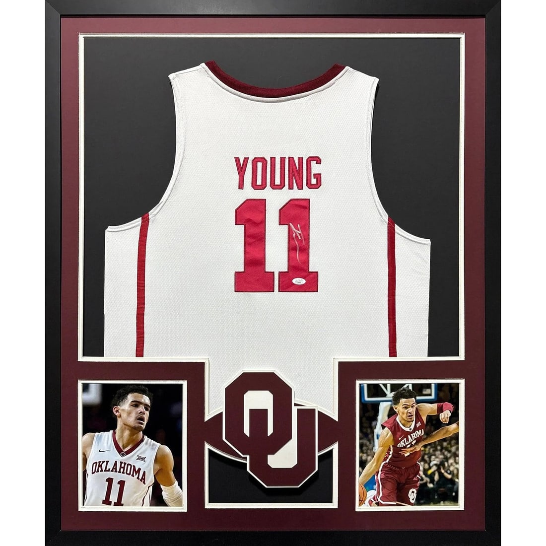 Framed Oklahoma White Jersey Signed by Trae Young with JSA Authentication: Framed Oklahoma White Jersey Signed by Trae Young with JSA Authentication This framed Oklahoma white jersey is autographed by Trae Young and includes authentication from JSA, featuring a tamper-proof 