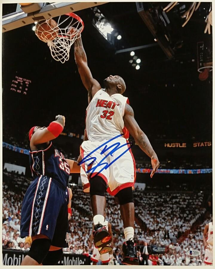 Shaquille O'Neal Signed 16x20 Miami Heat Photo with Beckett COA: Shaquille O'Neal Signed 16x20 Miami Heat Photo with Beckett COA Celebrate the legacy of basketball superstar Shaquille O'Neal with this signed 16x20 photo featuring him in his Miami Heat uniform. This