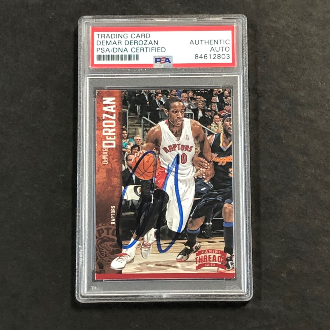 DeMar DeRozan PSA Authenticated Signed 2012-13 Basketball Card Toronto Raptors: DeMar DeRozan PSA Authenticated Signed 2012-13 Basketball Card Toronto Raptors This is an original 2012-13 Panini Threads #134 basketball card featuring DeMar DeRozan. The card is hand-signed by DeRoz