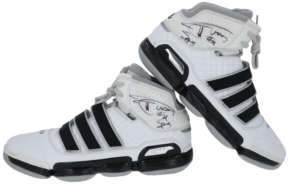 Tim Duncan Signed Game Used Adidas Sneakers with COA: Tim Duncan Signed Game Used Adidas Sneakers with COA Presenting a remarkable pair of game-used Adidas sneakers worn by NBA legend Tim Duncan, known for his dominance on the court with the San Antonio 