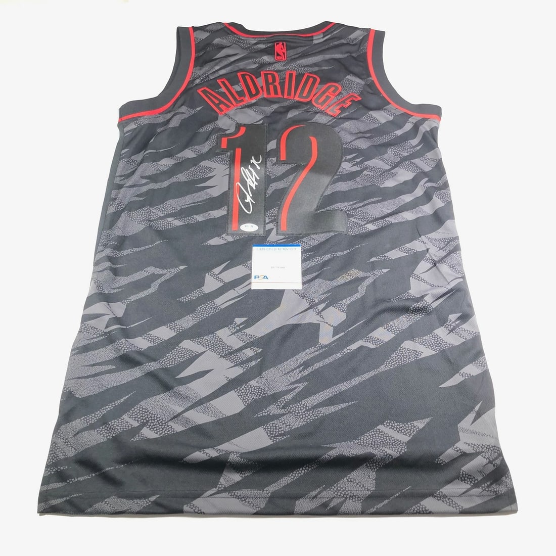LaMarcus Aldridge Autographed Jersey PSA/DNA Portland Trailblazers: LaMarcus Aldridge Autographed Jersey PSA/DNA Portland Trailblazers This is an original, pre-owned stitched jersey signed by LaMarcus Aldridge, featuring his autograph authenticated by PSA/DNA. The jer