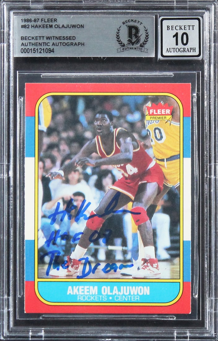Hakeem Olajuwon autographed 1986 Fleer #82 rookie card BAS slabbed: Hakeem Olajuwon autographed 1986 Fleer #82 rookie card BAS slabbed This 1986 Fleer #82 rookie card features an authentic hand-signed autograph from Hakeem Olajuwon, including the inscriptions "HOF 08,