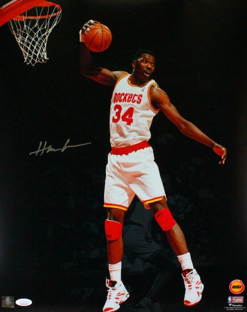Hakeem Olajuwon signed Houston Rockets 16x20 spotlight photo JSA silver: Hakeem Olajuwon signed Houston Rockets 16x20 spotlight photo JSA silver This 16x20 spotlight photo features Hakeem Olajuwon of the Houston Rockets and is autographed. The item is an original photograp