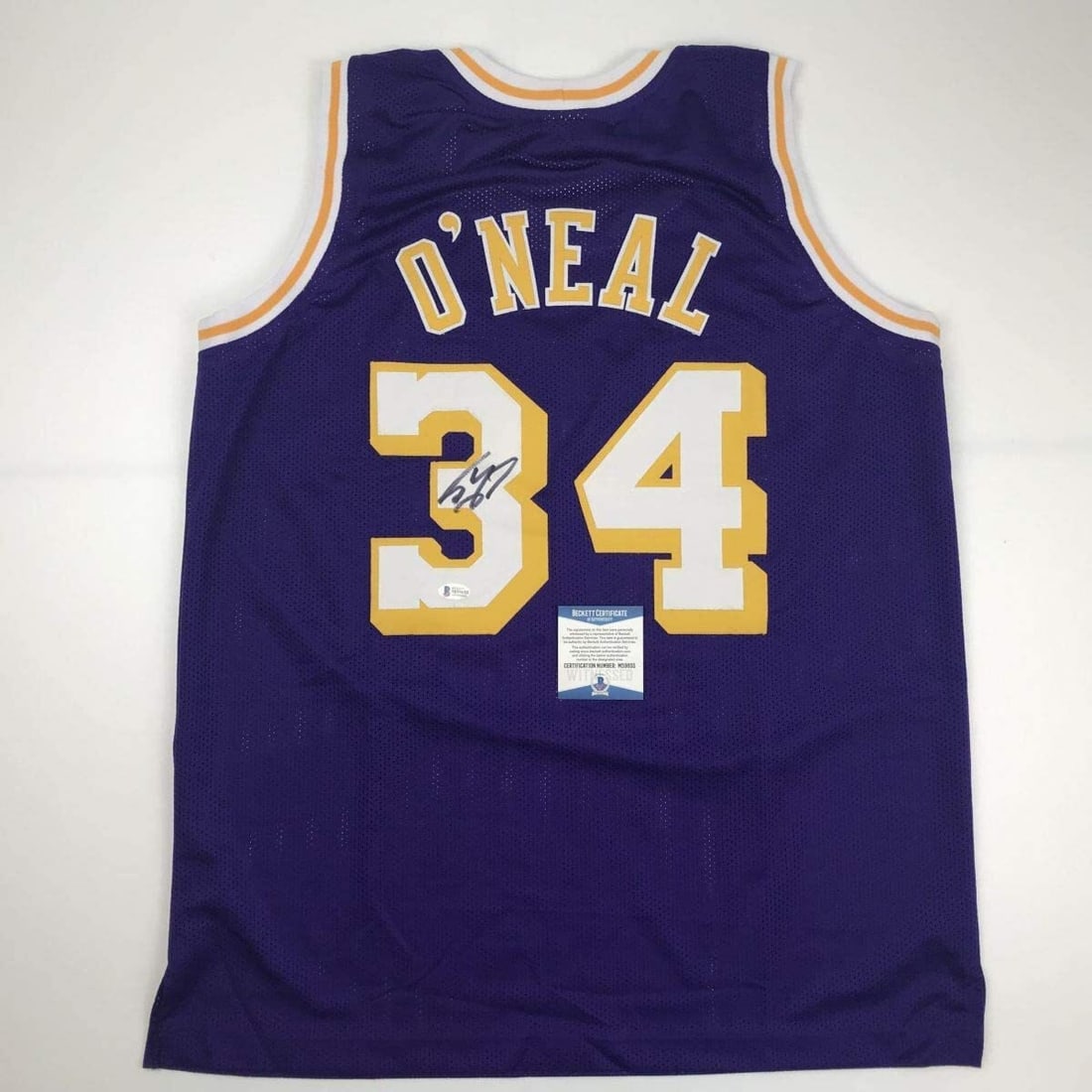 Autographed Shaquille O'Neal Lakers Purple Jersey Beckett COA Gem Mint: Autographed Shaquille O'Neal Lakers Purple Jersey Beckett COA Gem Mint Celebrate the legacy of NBA superstar Shaquille O'Neal with this autographed Los Angeles Lakers purple jersey. This custom jersey