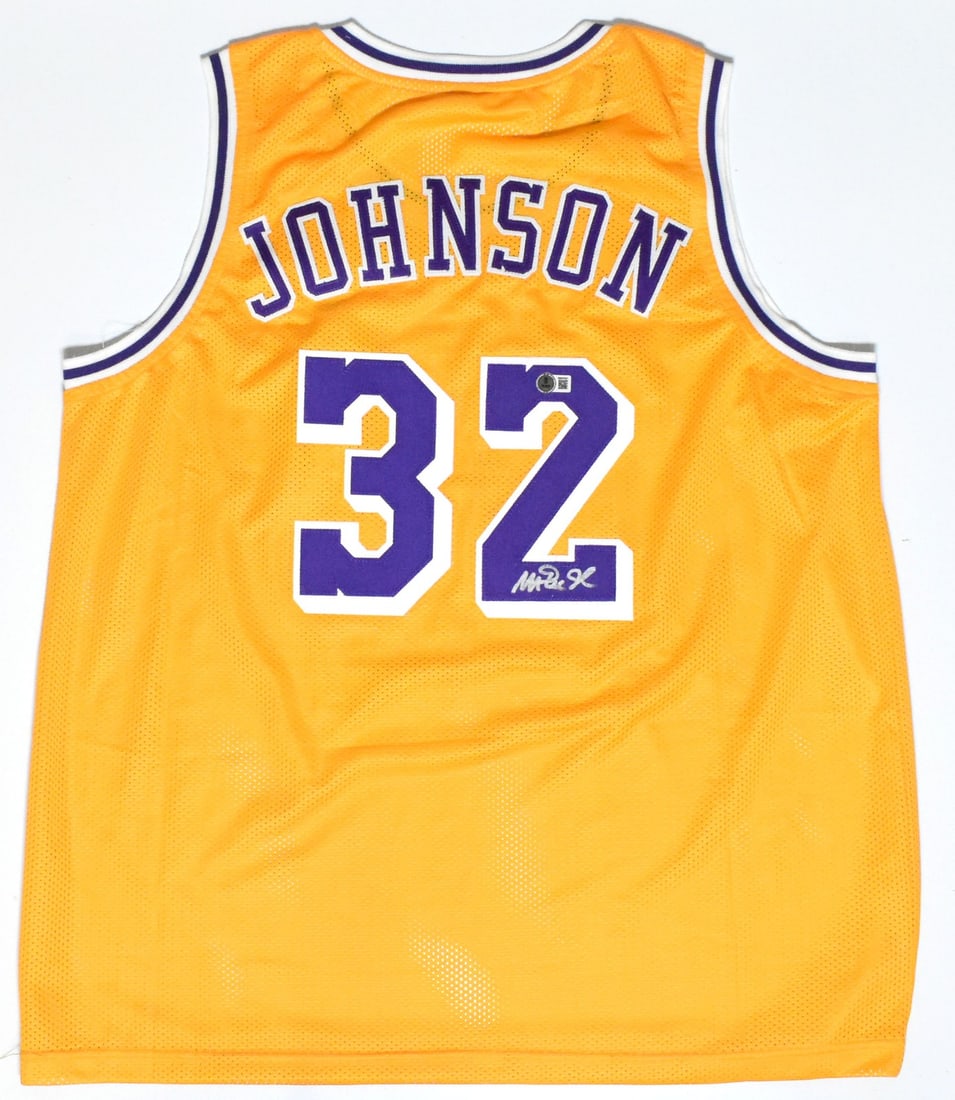 Magic Johnson signed Los Angeles Lakers gold pro style jersey Beckett hologram: Magic Johnson signed Los Angeles Lakers gold pro style jersey Beckett hologram This is a gold pro style jersey autographed by Magic Johnson, featuring a Beckett W hologram for authentication. The jers