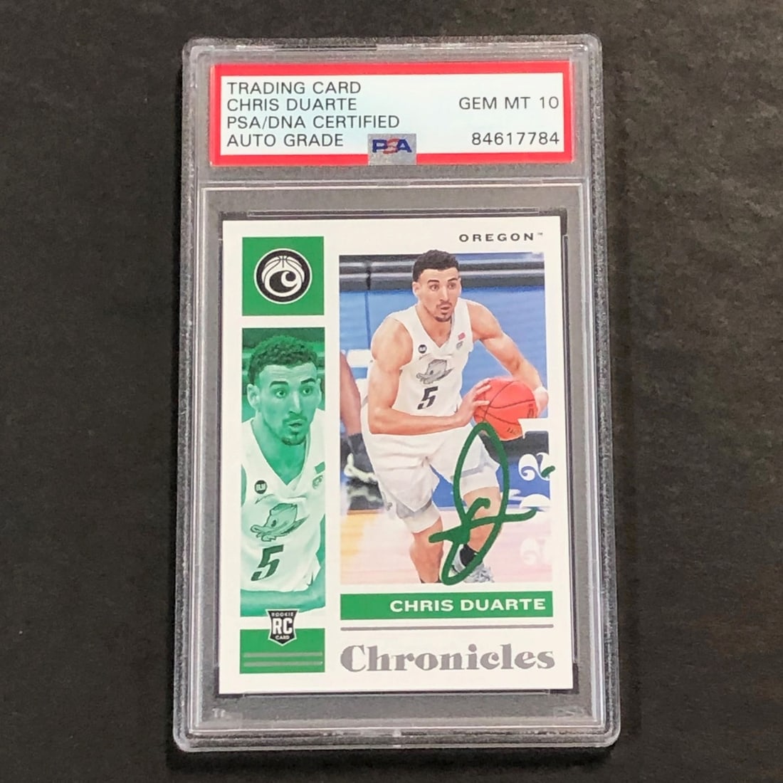 PSA slabbed Chris Duarte autographed 2021-22 Chronicles Draft Picks #18 card: PSA slabbed Chris Duarte autographed 2021-22 Chronicles Draft Picks #18 card This is an original 2021-22 Chronicles Draft Picks #18 basketball card featuring Chris Duarte. The card is signed by Chris 