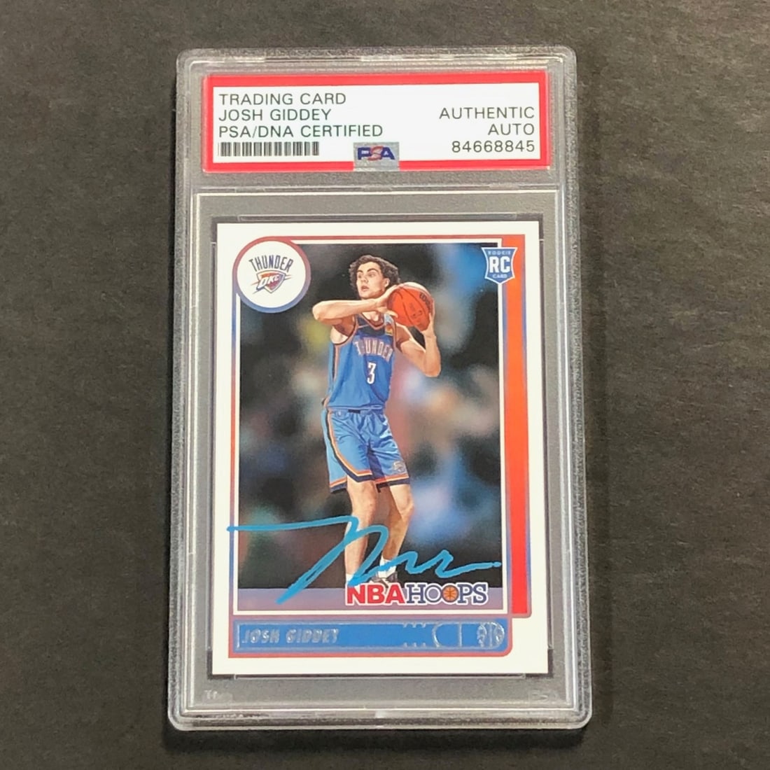 Josh Giddey Signed 2021-22 NBA Hoops #202 PSA Slabbed Card Thunder: Josh Giddey Signed 2021-22 NBA Hoops #202 PSA Slabbed Card Thunder This is a 2021-22 NBA Hoops #202 trading card featuring the autograph of Josh Giddey, encapsulated and authenticated by PSA/DNA Authe