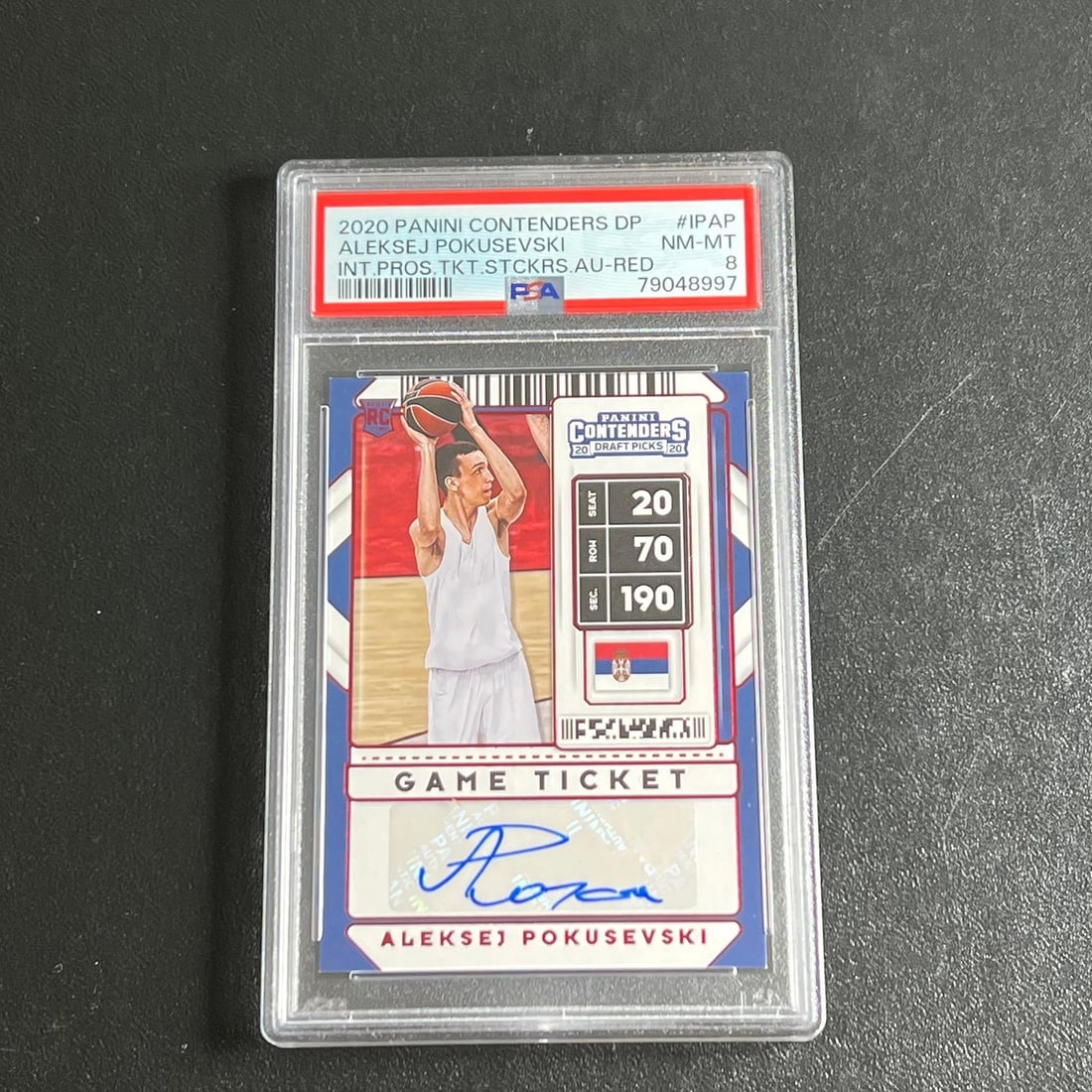 2020-21 Panini Contenders #20 Aleksej Pokusevski Signed PSA/DNA Authenticated Card: 2020-21 Panini Contenders #20 Aleksej Pokusevski Signed PSA/DNA Authenticated Card This listing features a 2020-21 Panini Contenders #20 card signed by Aleksej Pokusevski. The autograph has been authe