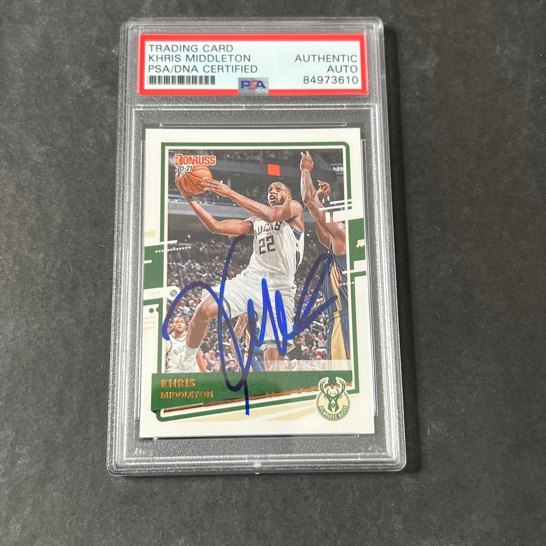 PSA DNA slabbed Khris Middleton autographed Panini Donruss card #185: PSA DNA slabbed Khris Middleton autographed Panini Donruss card #185 This is a 2020-21 Panini Donruss #185 trading card featuring Khris Middleton of the Milwaukee Bucks. The card is hand-signed by Khr