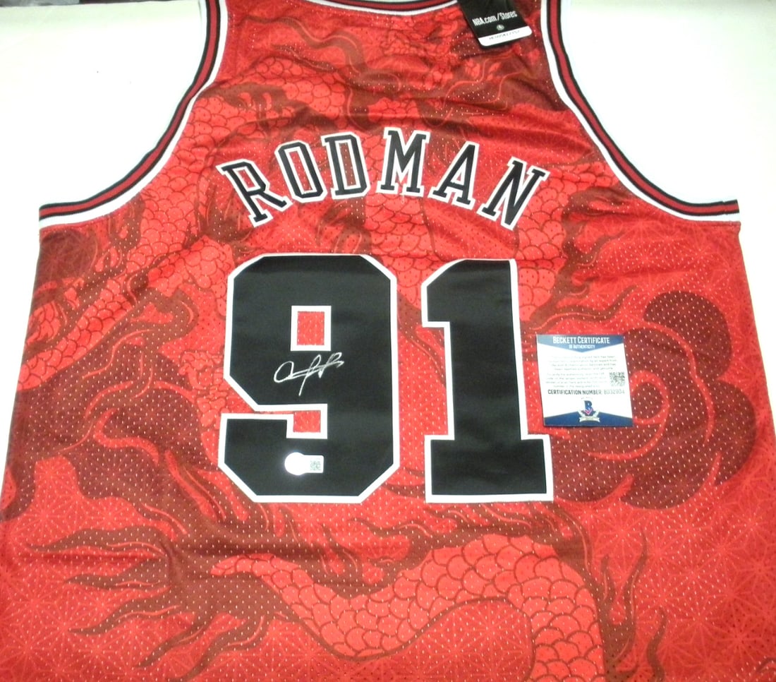 Signed Dennis Rodman Chicago Bulls Mitchell and Ness jersey Beckett COA: Signed Dennis Rodman Chicago Bulls Mitchell and Ness jersey Beckett COA This is an official licensed Mitchell & Ness Chicago Bulls jersey signed by Dennis Rodman. The jersey is an original item, not a