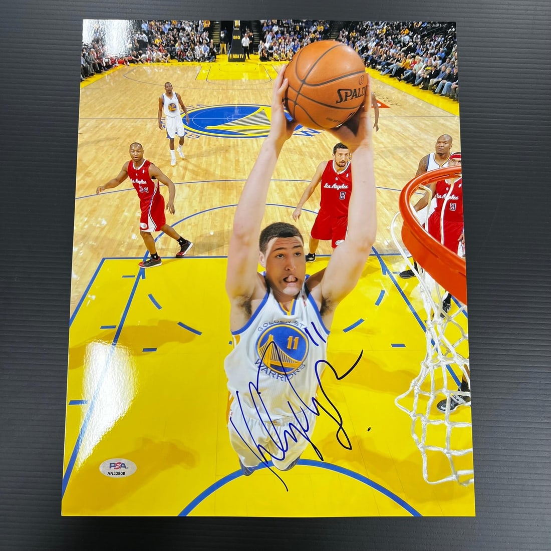Klay Thompson PSA DNA signed 11x14 basketball photo: Klay Thompson PSA DNA signed 11x14 basketball photo This is a professionally printed 11x14 photograph featuring Klay Thompson of the Golden State Warriors. The photo has been personally signed by Klay