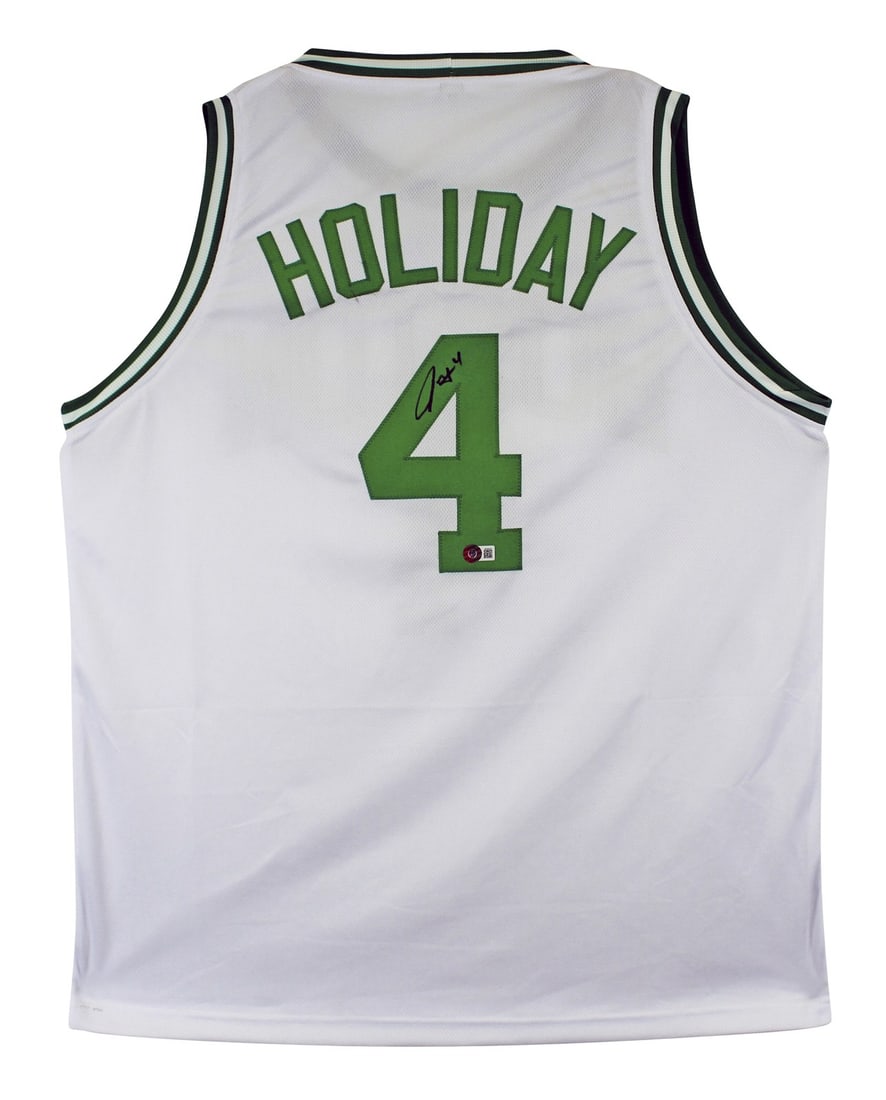 Boston Celtics Jrue Holiday signed white pro style jersey Beckett witnessed: Boston Celtics Jrue Holiday signed white pro style jersey Beckett witnessed This white pro style jersey has been personally signed by Jrue Holiday of the Boston Celtics. The autograph is authenticated