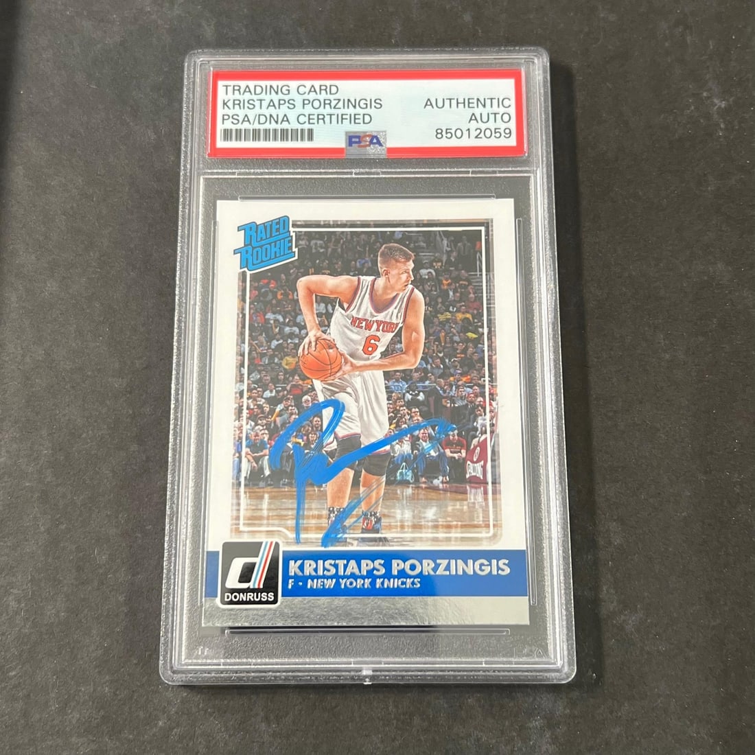 2015-16 Panini Donruss #239 Kristaps Porzingis Autographed PSA Slabbed Card: 2015-16 Panini Donruss #239 Kristaps Porzingis Autographed PSA Slabbed Card This is a 2015-16 Panini Donruss #239 trading card featuring Kristaps Porzingis, the talented player from the New York Knick