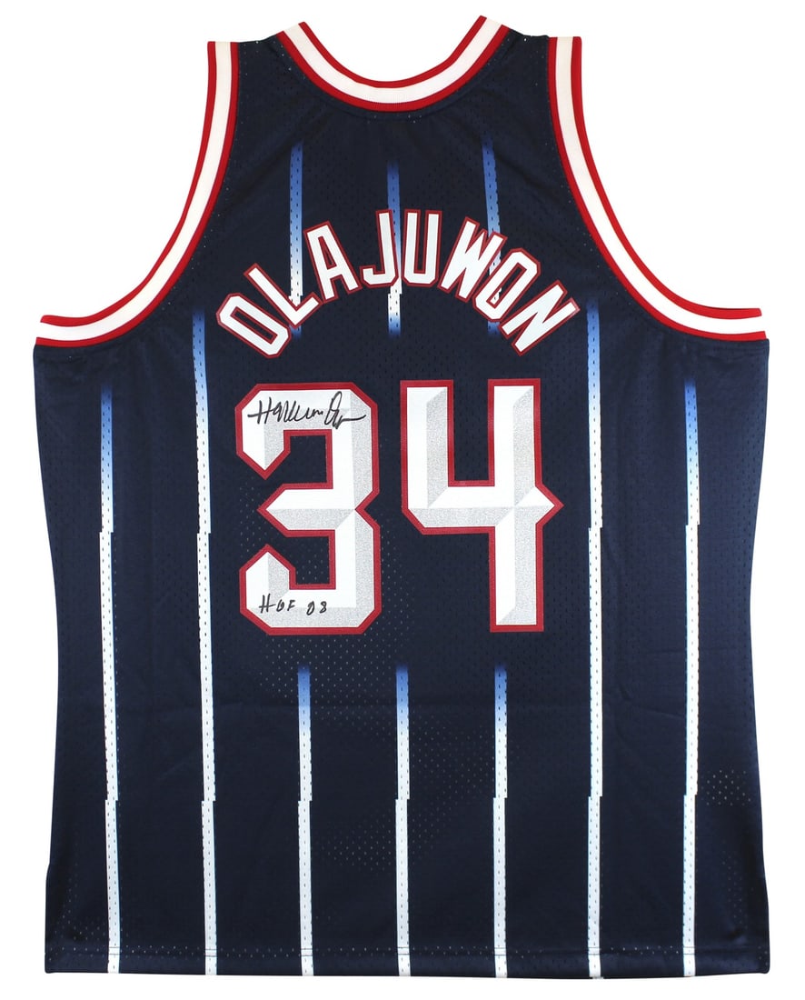 Hakeem Olajuwon Signed Navy Blue Mitchell & Ness Jersey HOF 08 Beckett Authenticated: Hakeem Olajuwon Signed Navy Blue Mitchell & Ness Jersey HOF 08 Beckett Authenticated Celebrate the legacy of Hakeem Olajuwon with this autographed Navy Blue Mitchell & Ness Jersey, inscribed with "HOF