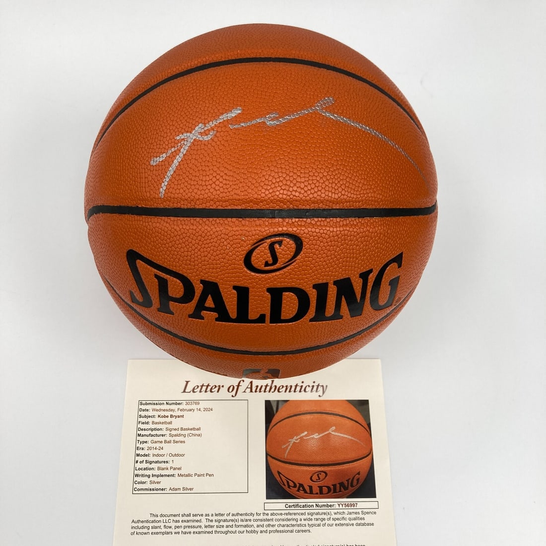Kobe Bryant Signed Spalding Basketball Silver Ink JSA Authenticated: Kobe Bryant Signed Spalding Basketball Silver Ink JSA Authenticated This Spalding Official Game Basketball features the signature of Hall of Famer Kobe Bryant, written in striking silver ink. A legend