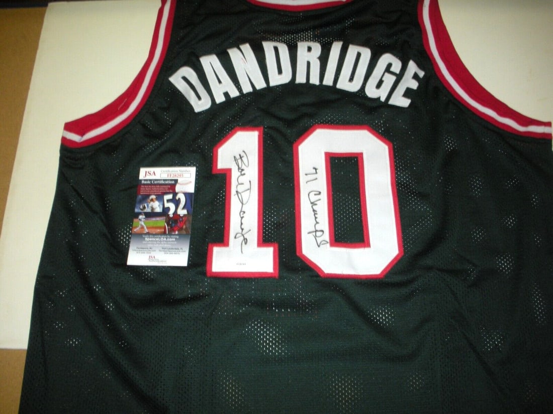 Green Milwaukee Bucks 1971 Champions Jersey Signed by Bob Dandridge JSA COA: Green Milwaukee Bucks 1971 Champions Jersey Signed by Bob Dandridge JSA COA This is a pre-owned Milwaukee Bucks green jersey signed by Bob Dandridge, commemorating the team's 1971 championship. The je