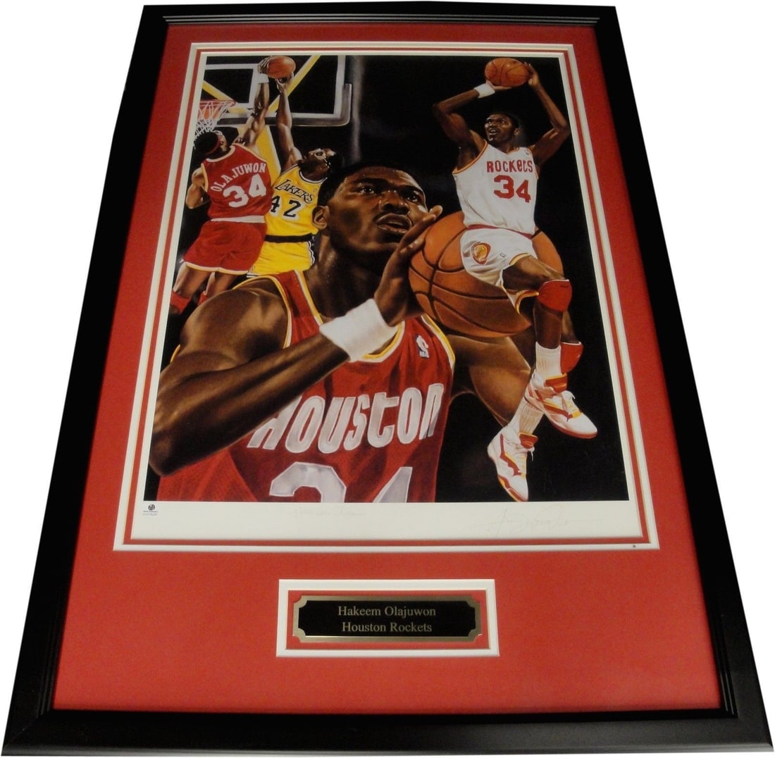 Framed 18"x24" Hakeem Olajuwon Signed Photo With Global Authentics COA: Framed 18"x24" Hakeem Olajuwon Signed Photo With Global Authentics COA This custom-framed 18" x 24" photograph features Hakeem Olajuwon's authentic hand-signed autograph. The photo is an original and 