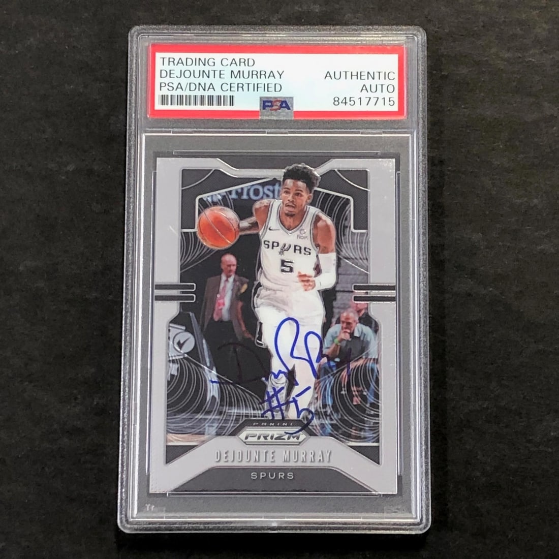 PSA Slabbed Dejounte Murray Autographed 2019-20 Panini Prizm #138 Spurs Card: PSA Slabbed Dejounte Murray Autographed 2019-20 Panini Prizm #138 Spurs Card This is a 2019-20 Panini Prizm #138 trading card featuring Dejounte Murray of the San Antonio Spurs. The card has been hand