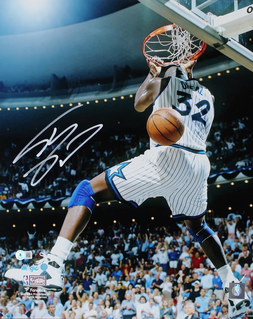 Shaquille O'Neal Signed 16x20 Dunk Photo Orlando Magic BAS Authenticated: Shaquille O'Neal Signed 16x20 Dunk Photo Orlando Magic BAS Authenticated This authentic 16x20 vertical dunk photo features the iconic Shaquille O'Neal of the Orlando Magic, personally signed for fans 