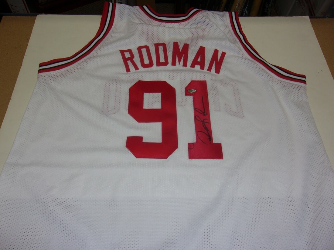 Dennis Rodman Autographed Chicago Bulls Jersey With COA 5-Time NBA Champion: Dennis Rodman Autographed Chicago Bulls Jersey With COA 5-Time NBA Champion This pre-owned Chicago Bulls jersey is signed by Dennis Rodman and comes with a certificate of authenticity. It is an origin
