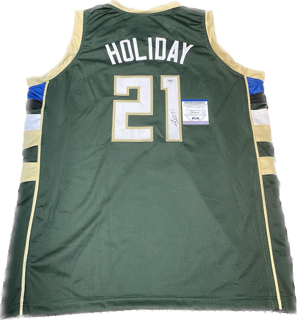 PSA DNA authenticated Jrue Holiday Milwaukee Bucks signed basketball jersey: PSA DNA authenticated Jrue Holiday Milwaukee Bucks signed basketball jersey This is a stitched Milwaukee Bucks jersey autographed by Jrue Holiday. The autograph has been authenticated by PSA/DNA exper