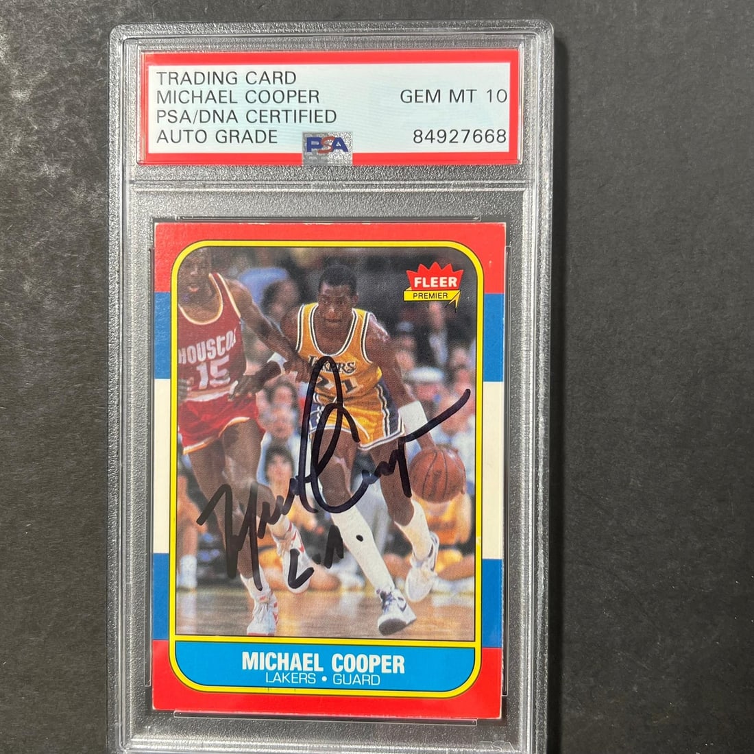 1986 Fleer #17 Michael Cooper Autographed Card PSA/DNA Authentic Lakers: 1986 Fleer #17 Michael Cooper Autographed Card PSA/DNA Authentic Lakers This is a 1986 Fleer #17 trading card featuring the signature of Michael Cooper, a prominent player for the Los Angeles Lakers. 