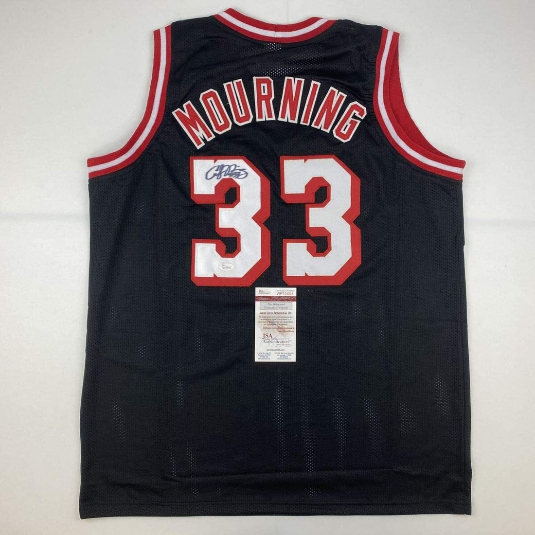 Alonzo Mourning Autographed Miami Heat Black Jersey JSA COA Gem Mint: Alonzo Mourning Autographed Miami Heat Black Jersey JSA COA Gem Mint Celebrate the legacy of Alonzo Mourning with this autographed Miami Heat black basketball jersey. This custom jersey features Mourn