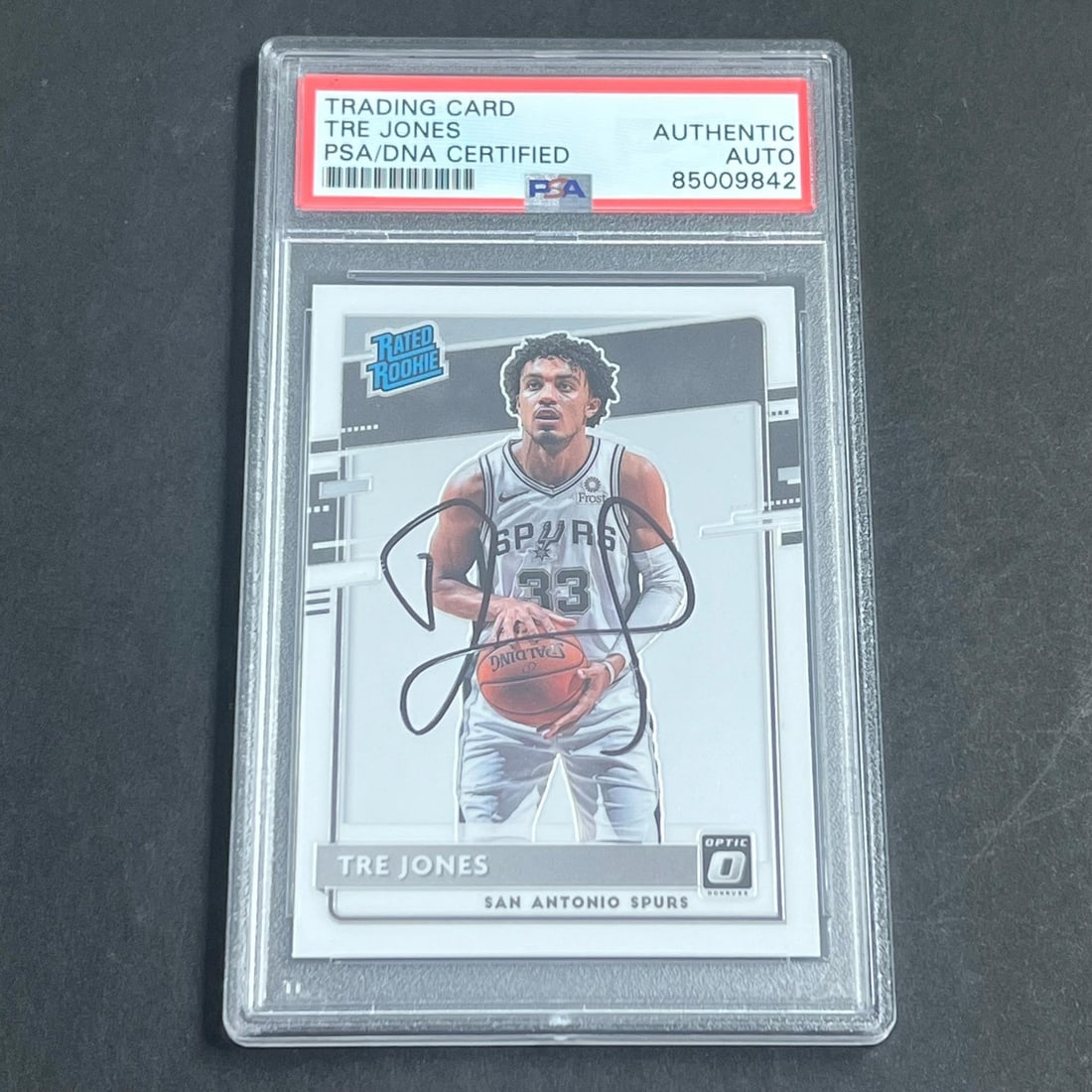 2020-21 Panini Donruss Optic Tre Jones Signed Rookie Card PSA/DNA: 2020-21 Panini Donruss Optic Tre Jones Signed Rookie Card PSA/DNA This listing features a 2020-21 Panini Donruss Optic #188 rookie card signed by Tre Jones of the San Antonio Spurs. The autograph has 
