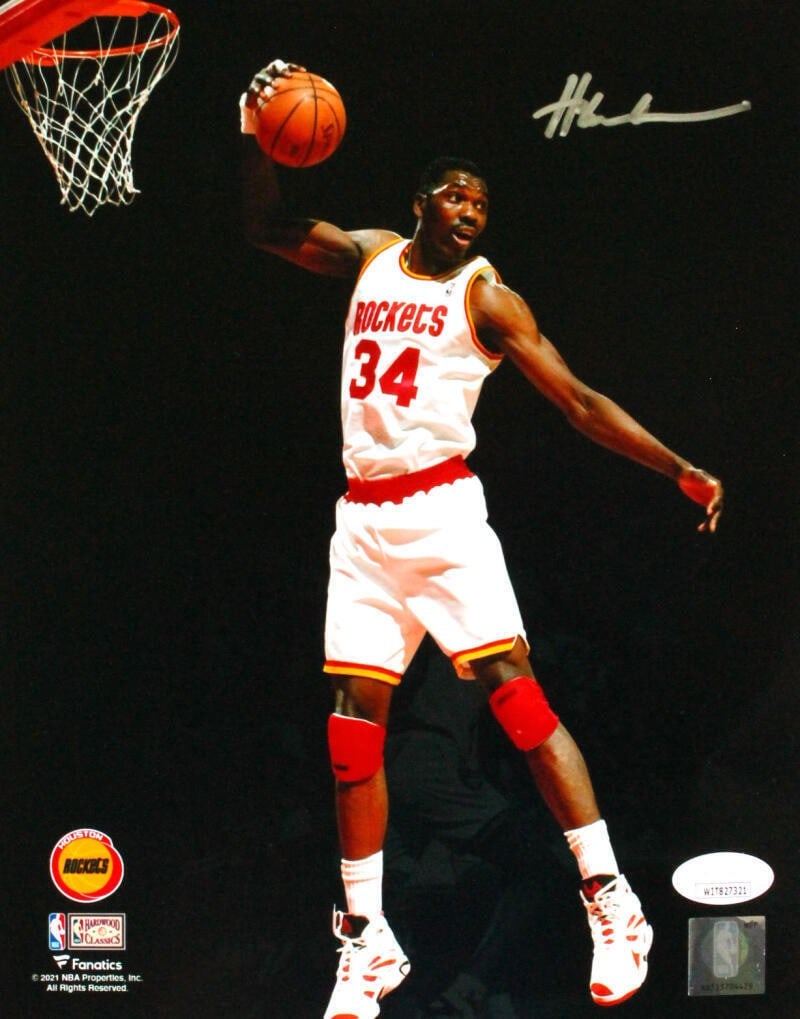 Hakeem Olajuwon signed Houston Rockets 8x10 spotlight photo JSA silver (1 of 2)