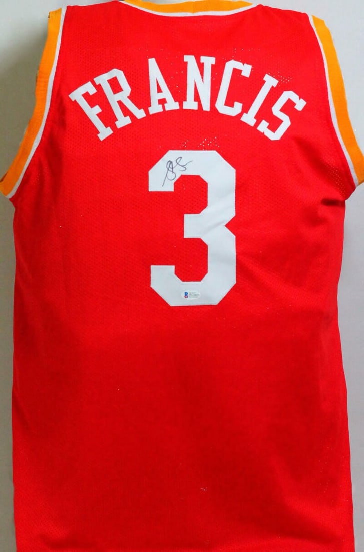 Houston Rockets Steve Francis signed red yellow pro style jersey Beckett: Houston Rockets Steve Francis signed red yellow pro style jersey Beckett This is a red pro style jersey with yellow accents, autographed by Steve Francis. The jersey features authentication by