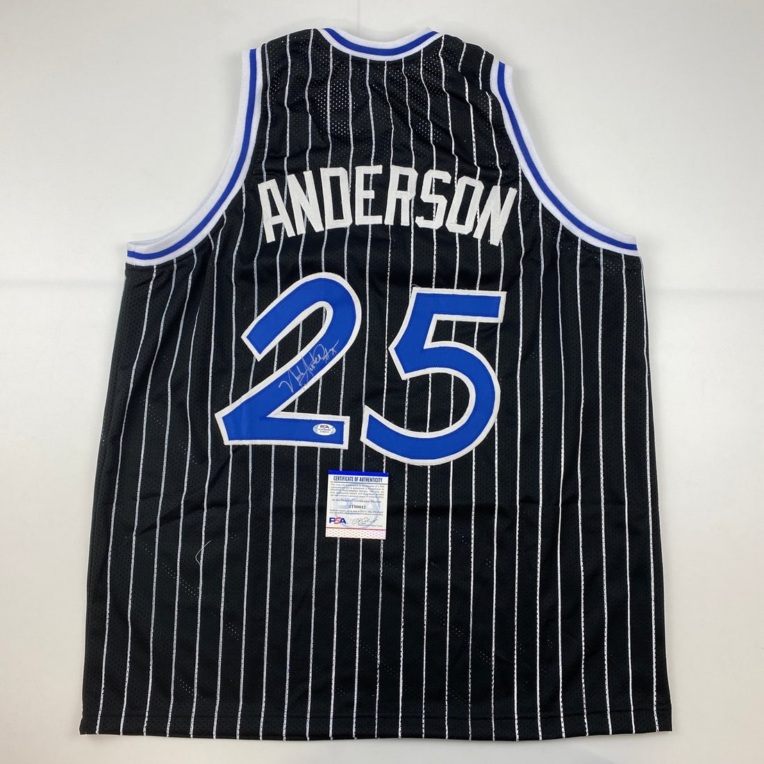 Nick Anderson Autographed Orlando Black Pinstripe Jersey PSA/DNA COA: Nick Anderson Autographed Orlando Black Pinstripe Jersey PSA/DNA COA This authentic Nick Anderson Orlando Black Pinstripe Jersey is a must-have for any basketball fan. The jersey features the iconic b