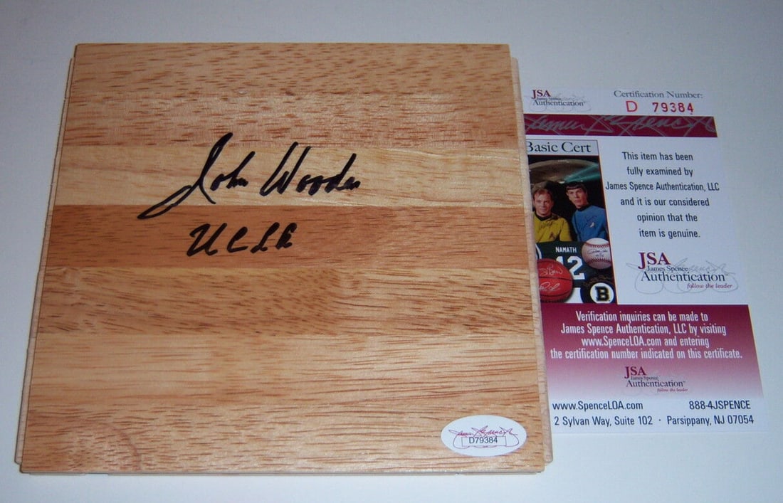 6x6 Floorboard Autographed by John Wooden with JSA COA: 6x6 Floorboard Autographed by John Wooden with JSA COA This is a pre-owned 6x6 floorboard signed by John Wooden, renowned coach of the UCLA Bruins basketball team. The item includes JSA/COA authentica
