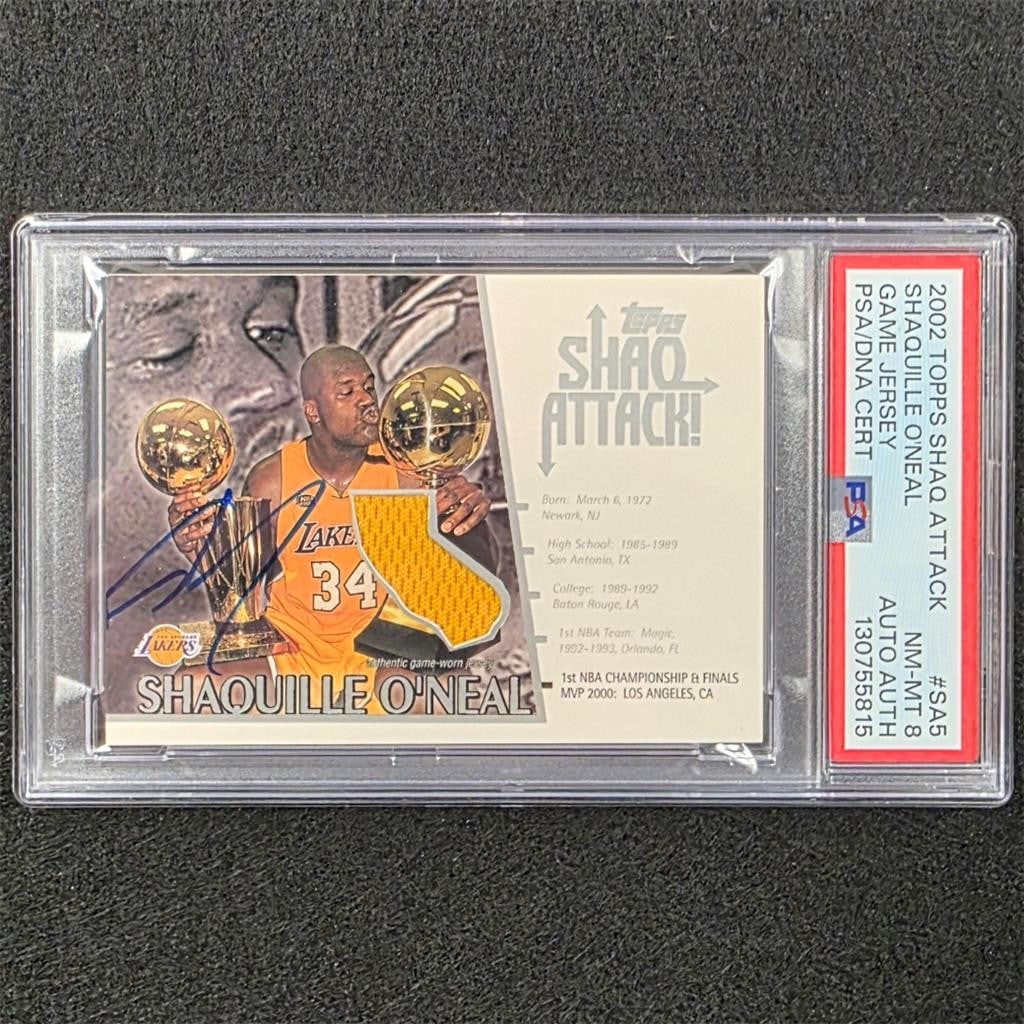 PSA 8 Shaquille O'Neal 2002 Topps Shaq Attack jersey auto card SA5: PSA 8 Shaquille O'Neal 2002 Topps Shaq Attack jersey auto card SA5 This is an original 2002 Topps Shaq Attack! Game-Used Jersey sports trading card featuring Shaquille O'Neal. The card is hard signed 