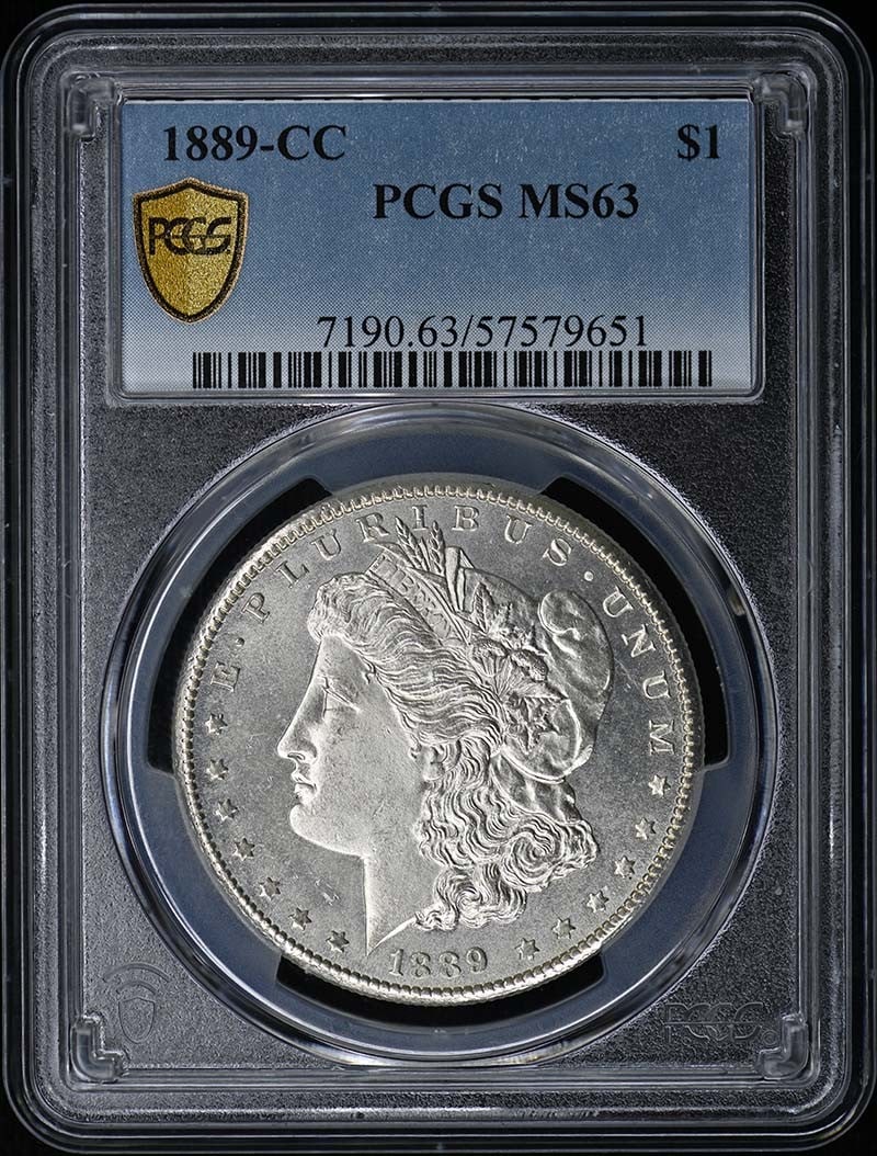 PCGS MS63 1889 CC Morgan Dollar Carson City: PCGS MS63 1889 CC Morgan Dollar Carson City This is an 1889-CC Morgan Dollar graded MS63 by PCGS. Minted in Carson City, this uncirculated coin is a desirable piece for collectors of United States cur