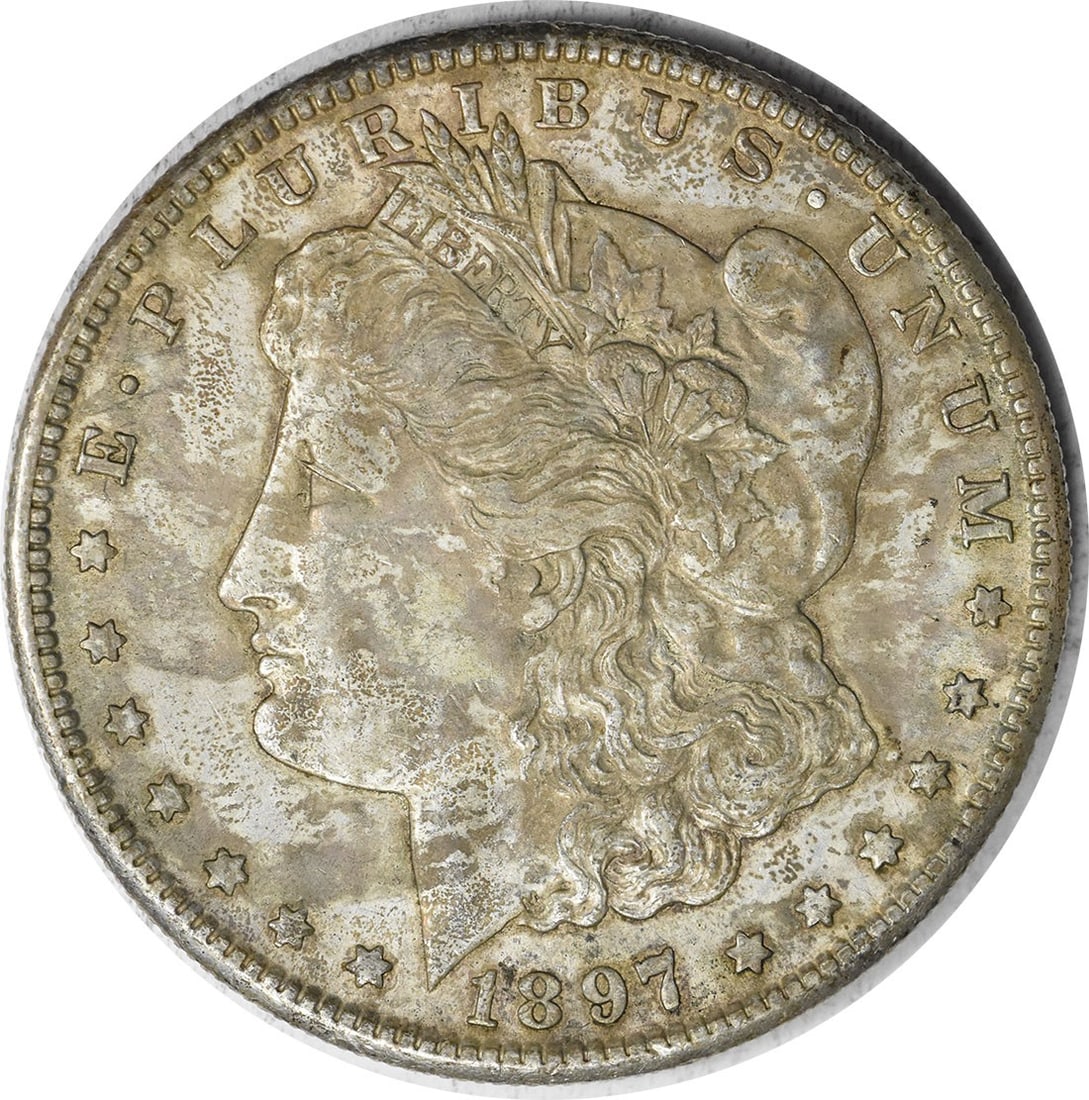 1897-S Morgan Silver Dollar AU Uncertified Coin by George T. Morgan: 1897-S Morgan Silver Dollar AU Uncertified Coin by George T. Morgan This 1897-S Morgan Silver Dollar is a classic coin that showcases the artistry of designer George T. Morgan. It features a beautiful