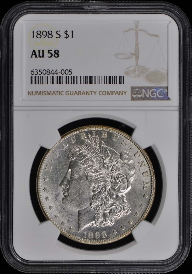 1898-S Morgan Dollar NGC AU58 Certified San Francisco Coin: 1898-S Morgan Dollar NGC AU58 Certified San Francisco Coin This 1898-S Morgan Dollar in AU58 grade is a classic addition for any coin collector. Certified by NGC, this coin showcases the beautiful des
