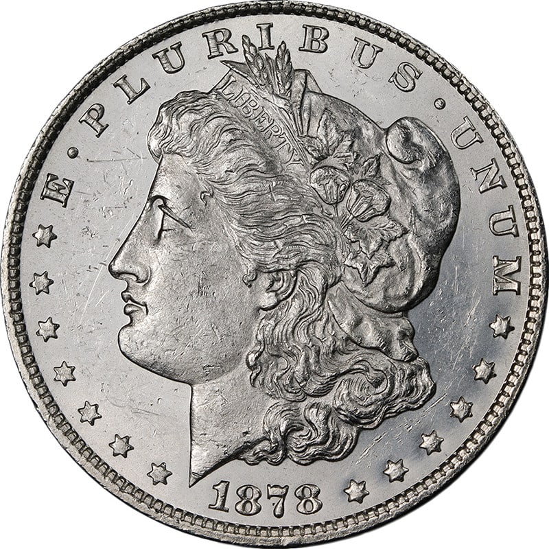1878-P Morgan Silver Dollar 7 8TF Weak Strike BU+: 1878-P Morgan Silver Dollar 7 8TF Weak Strike BU+ This 1878-P 7/8 Tail Feathers (Weak) Morgan Silver Dollar is an uncirculated coin featuring attractive luster, strong strike, and bright white