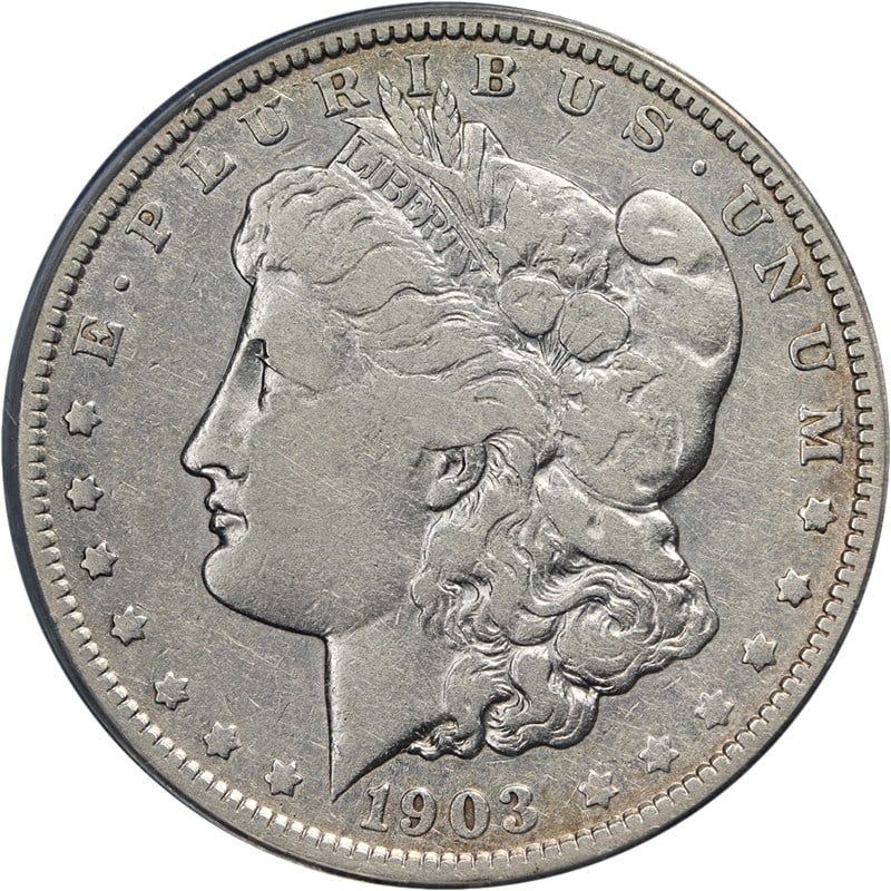 1903 O Morgan Dollar ANACS VF20 Key Date Silver: 1903 O Morgan Dollar ANACS VF20 Key Date Silver This 1903-O Morgan Silver Dollar is graded VF20 by ANACS and is a key date for collectors. The coin features attractive color, appealing surfaces, and a