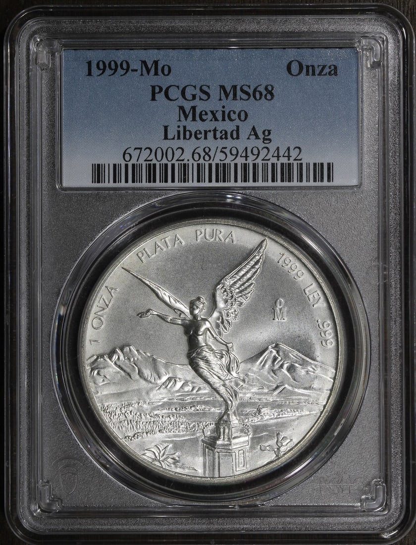 PCGS MS68 1999-Mo Mexico 1 oz Silver Libertad Key Date Coin: PCGS MS68 1999-Mo Mexico 1 oz Silver Libertad Key Date Coin This is a 1999 Mexico 1 oz Silver Libertad coin graded MS68 by PCGS. It is composed of 0.999 fine silver and identified as a key date issue.