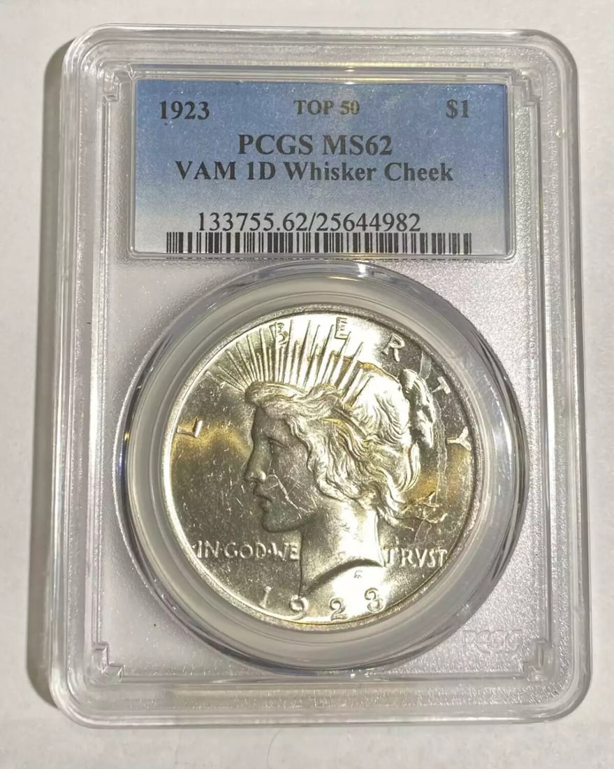 1923 P Peace Silver Dollar MS 62 VAM 1D PCGS Certified: 1923 P Peace Silver Dollar MS 62 VAM 1D PCGS Certified This 1923 Peace Silver Dollar, minted in Philadelphia, is graded MS-62 by PCGS, ensuring a high-quality uncirculated state. The coin features a s