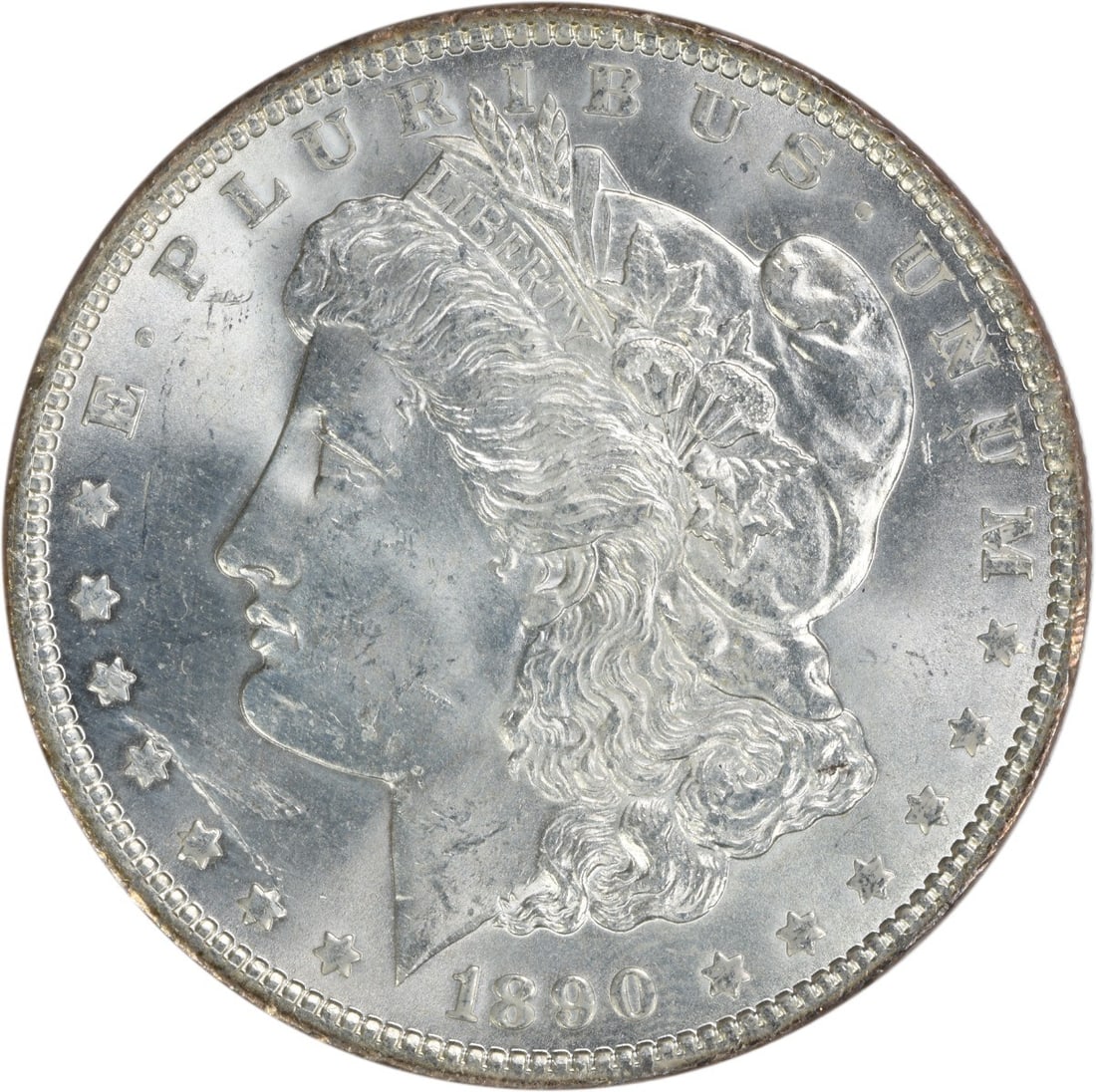 1890 Silver Morgan Dollar Brilliant Uncirculated Uncertified US Coin: 1890 Silver Morgan Dollar Brilliant Uncirculated Uncertified US Coin This is an uncirculated 1890 Morgan Silver Dollar. Composed of silver, this coin features no mint mark and is graded as Brilliant U