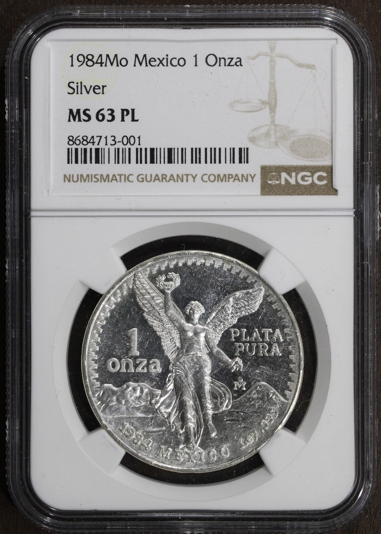1984 Mexico Silver Libertad Onza 1 oz NGC MS63PL: 1984 Mexico Silver Libertad Onza 1 oz NGC MS63PL This 1984 Mexican Libertad 1 oz silver coin is graded MS63PL by NGC, indicating its prooflike qualities and well-preserved condition. Minted by the Mex