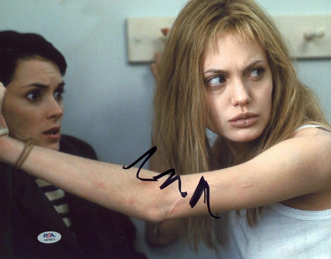 Angelina Jolie Autographed 11x14 Girl Interrupted Photo PSA DNA Authenticated: Angelina Jolie Autographed 11x14 Girl Interrupted Photo PSA DNA Authenticated This is an authentic 11x14 horizontal photograph featuring Angelina Jolie from the film "Girl, Interrupted," personally si