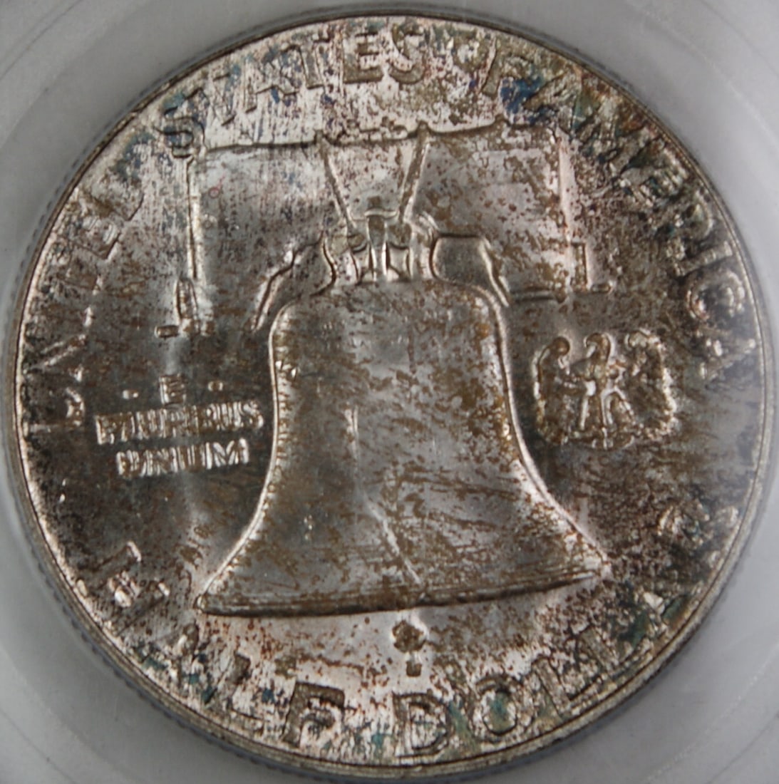 1956 Franklin 50C Silver Coin PCGS MS-65 FBL Toned Reverse: 1956 Franklin 50C Silver Coin PCGS MS-65 FBL Toned Reverse This is a 1956 Franklin Silver Half Dollar from the Philadelphia Mint, graded MS-65 Full Bell Lines by PCGS. The coin features a beautifully 