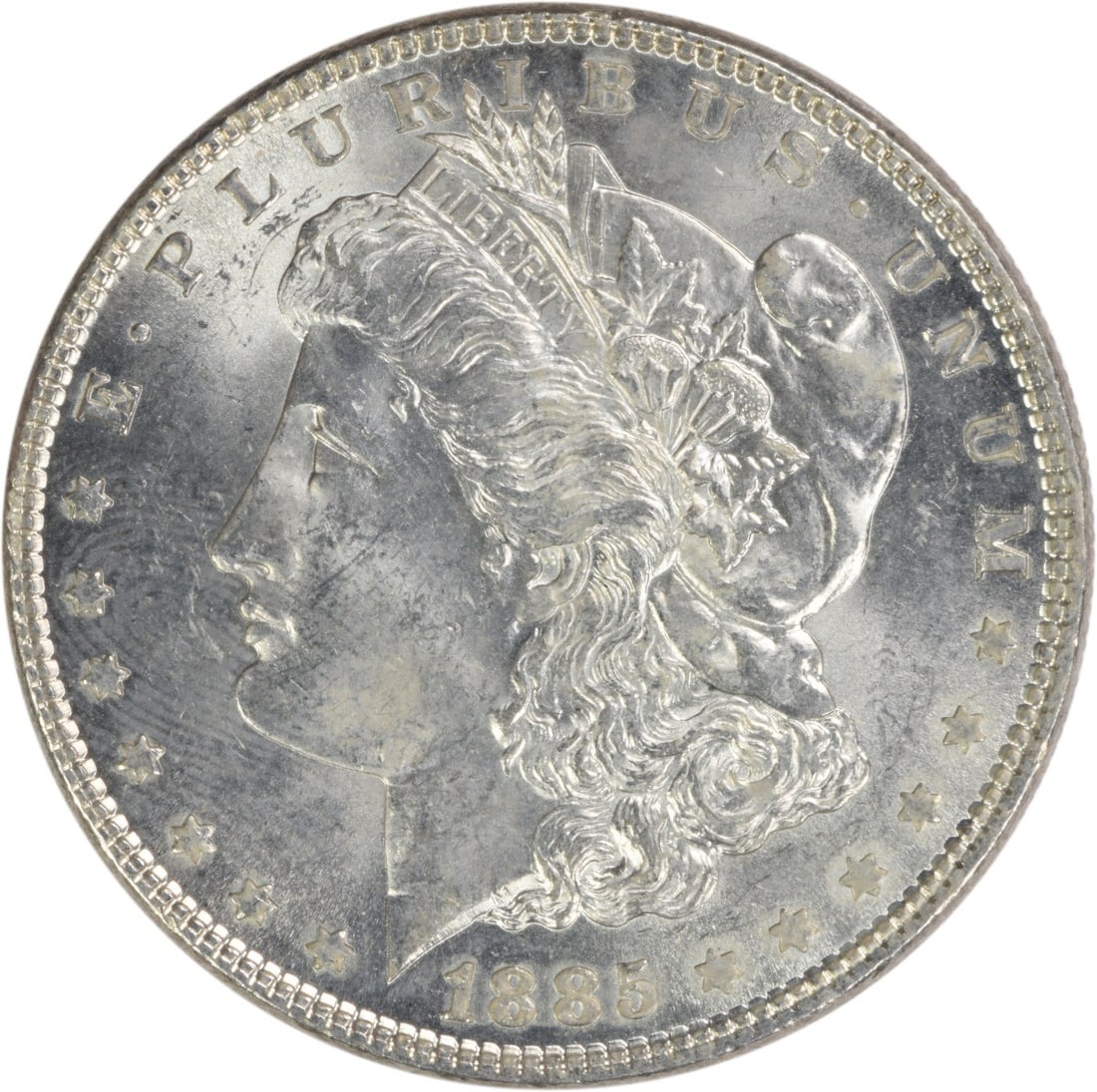 Choice BU 1885 Morgan Silver Dollar Uncirculated Uncertified US Coin: Choice BU 1885 Morgan Silver Dollar Uncirculated Uncertified US Coin This 1885 Morgan Silver Dollar is a Choice Brilliant Uncirculated (BU) coin from the United States. Struck in silver with no mint m