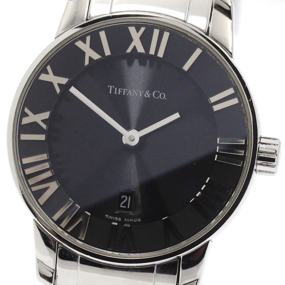 Tiffany Atlas Dome stainless steel quartz ladies date watch: Tiffany Atlas Dome stainless steel quartz ladies date watch This pre-owned Tiffany & Co. Atlas Dome Date Quartz ladies wristwatch features a stainless steel case and bracelet with a black dial. The wa